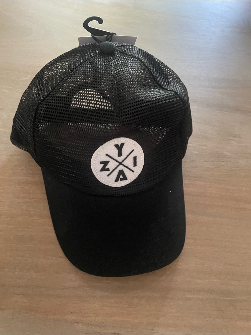ZYIA Black Mesh Trucker Hat with White Logo Patch